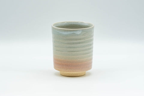 Japanese Teacup - Spiral Tsutsu-gata Hagi-yaki Yunomi - 150ml - front view showing the cream and peach crazed glaze with a white-glazed lip