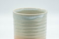 Japanese Teacup - Spiral Tsutsu-gata Hagi-yaki Yunomi - 150ml - closeup of the spiral ribbed glaze texture on the side