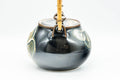 Tezumi — Japanese Dobin - Black Floral Debeso Top-Handle Teapot - 600ml — side view showing the spout