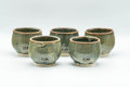Tezumi — Japanese Tea Set - Green Drip-Glazed Debeso Kyusu Teapot with 5 Yunomi Teacups — closeup of a single piece