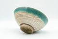 Japanese Matcha Bowl - Teal Drip-Glazed Agano-yaki Chawan - 250ml - angled side view showing the foot and needle-chattered pattern