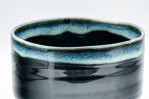 Tezumi — Japanese Matcha Bowl - Jet Black and Blue Drip-Glazed Chawan - 500ml — tipped to show the interior