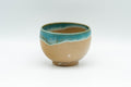 Japanese Teacup - 上野焼 Gold-flecked Agano-yaki Yunomi - 80ml - front view showing the turquoise gold-flecked enamel dripping over the beige body