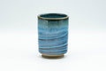 Japanese Teacup - Sky Blue Glazed Tsutsu-gata Yunomi - 170ml - front view of the yunomi showing the streaked blue glaze