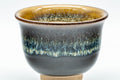 Japanese Teacups - Set of 5 Drip-Glazed Yunomi - 80ml - closeup of a single teacup showing the beige interior and orange lip