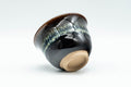 Japanese Teacups - Set of 5 Drip-Glazed Yunomi - 80ml - a teacup tilted to show the unglazed foot