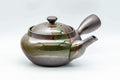 Tezumi — Japanese Kyusu - 萬古焼 Obi-ami Banko-yaki Teapot with Green Ash Glaze - 350ml — side view with the lid and side handle