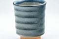 Tezumi — Japanese Teacup - Matte Blue Spiraling Yunomi - 160ml — tipped to show the interior