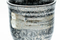 Tezumi — Japanese Teacup - Hakeme Spotted Black Glazed Yunomi - 180ml — tipped to show the interior