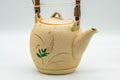 Japanese Tea Set - Floral Beige Glazed Debeso Dobin Teapot and 2 Yunomi Teacups - three-quarter view of the dobin showing the bamboo-style top handle