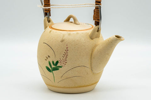 Japanese Tea Set - Floral Beige Glazed Debeso Dobin Teapot and 2 Yunomi Teacups - three-quarter view of the dobin showing the bamboo-style top handle