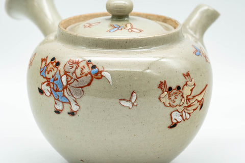 Japanese Tea Set - Banko-yaki Butterflies Kyusu Teapot and 2 Yunomi Teacups - closeup of the speckled grey glaze with butterfly and floral painting