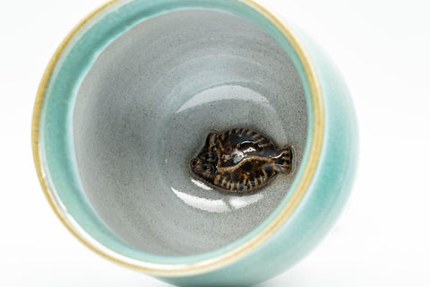 Tezumi — Japanese Teacup - Ceramic Fish Pet Green Glazed Yunomi - 150ml — tipped to show the interior