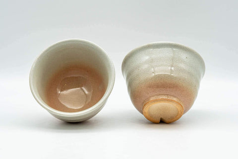 Tezumi — Japanese Teacups - Pair of Beige Peach Classic Hagi-yaki Yunomi - 100ml — three-quarter view