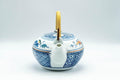 Tezumi — Japanese Dobin - Blue Floral Parrots White Debeso Teapot - 600ml — side view with the lid and side handle