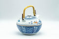 Tezumi — Japanese Dobin - Blue Floral Parrots White Debeso Teapot - 600ml — side view showing the spout