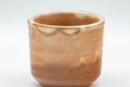 Tezumi — Japanese Teacup - Beige Tsutsu-gata Hagi-yaki Guinomi - 50ml — tipped to show the interior