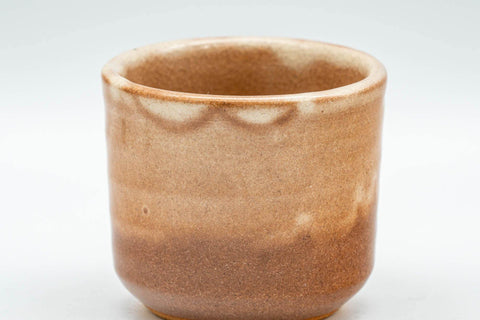 Tezumi — Japanese Teacup - Beige Tsutsu-gata Hagi-yaki Guinomi - 50ml — tipped to show the interior