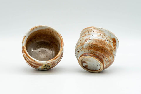 Tezumi — Japanese Teacups - Pair of Orange Shino Glazed Guinomi - 60ml — three-quarter view