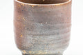Tezumi — Japanese Teacup - Brown Textured Tsutsu-gata Bizen-yaki Yunomi - 200ml — tipped to show the interior