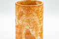 Tezumi — Japanese Teacup - Orange Shino Glazed Tsutsu-gata Yunomi - 130ml — tipped to show the interior