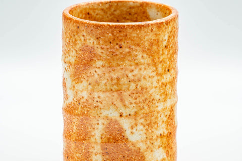 Tezumi — Japanese Teacup - Orange Shino Glazed Tsutsu-gata Yunomi - 130ml — tipped to show the interior