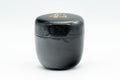 Japanese Natsume - ね Hentaigana Black Lacquer Matcha Tea Caddy - 100ml - side view of the closed natsume