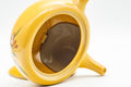 Tezumi — Japanese Kyusu - Floral Yellow Tokoname-yaki Teapot - 300ml — side profile showing the spout and handle