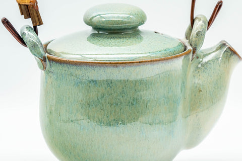 Japanese Tea Set - Green Glazed Dobin Do-ake Teapot with Katakuchi Water Cooler and 2 Yunomi Teacups - three-quarter closeup of the flowing green glaze