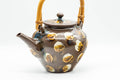 Tezumi — Japanese Tea Set - Brown Dobin Do-ake Teapot with 3 Yunomi Teacups — the teapot side view with the handle