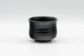 Tezumi — Japanese Teacup - Matte Black Glazed Geometric Motif Yunomi - 70ml — front view from another angle