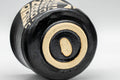Tezumi — Japanese Teacup - Matte Black Glazed Geometric Motif Yunomi - 70ml — inverted showing the foot ring