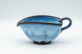 Tezumi — Japanese Yuzamashi - Blue Shino Glazed Ushirode Water Cooler - 150ml — three-quarter view