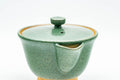Tezumi — Japanese Tea Set - Houhin Teapot, Katakuchi Water Cooler, and 3 Yunomi Teacups — closeup of a single piece