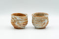 Tezumi — Japanese Teacups - Pair of Orange Shino Glazed Guinomi - 60ml — front view from another angle