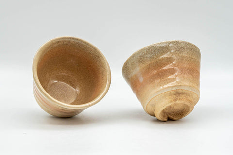 Tezumi — Japanese Teacups - Pair of Beige and Peach Asagao-gata Hagi-yaki Yunomi - 100ml — three-quarter view