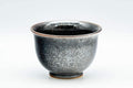 Tezumi — Japanese Teacups - Pair of Shiny Black Glazed Yunomi - 100ml — three-quarter view