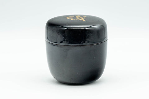 Japanese Natsume - ね Hentaigana Black Lacquer Matcha Tea Caddy - 100ml - closed natsume showing the wood-grain lacquer finish