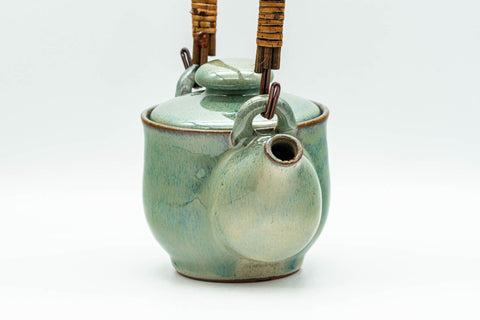 Japanese Tea Set - Green Glazed Dobin Do-ake Teapot with Katakuchi Water Cooler and 2 Yunomi Teacups - side view of the blue-green glazed dobin teapot
