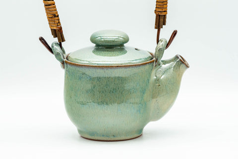 Japanese Tea Set - Green Glazed Dobin Do-ake Teapot with Katakuchi Water Cooler and 2 Yunomi Teacups - three-quarter view of the dobin showing the bamboo top handle
