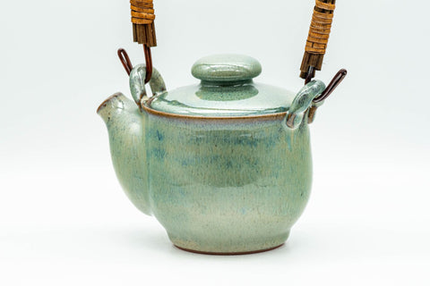 Japanese Tea Set - Green Glazed Dobin Do-ake Teapot with Katakuchi Water Cooler and 2 Yunomi Teacups - side view of the dobin from the spout side