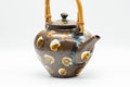 Tezumi — Japanese Tea Set - Brown Dobin Do-ake Teapot with 3 Yunomi Teacups — the teapot in three-quarter view