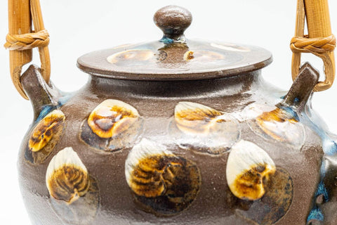 Tezumi — Japanese Tea Set - Brown Dobin Do-ake Teapot with 3 Yunomi Teacups — closeup of the decoration