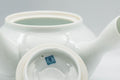 Tezumi — Japanese Tea Set - 畑萬陶苑 Hataman Toen - Arita-yaki Porcelain Debeso Kyusu with 2 Yunomi Teacups — closeup of a single piece